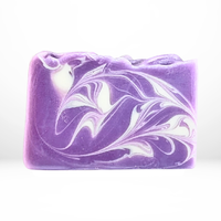 Bar of the 'San Juan Sachet' purple and white colored soap on a white background with no packaging